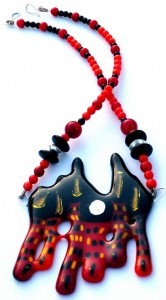 Necklace with townhouse glass pendant in red and orange with coral and onyx beads with sterling silver