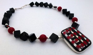 Black onyx and red lacquered white coral necklace with fused glass pendant