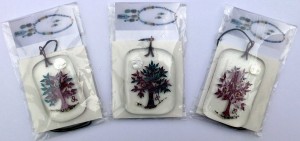 Three fused glass trees with fruit and moon packaged