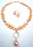 Pearl necklace and earrings in orange