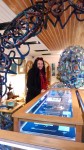 Jutta in front of the display cabinets at Primavera