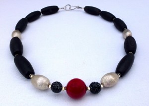 Necklace with black agate, sterling silver beads and a red coral centre
