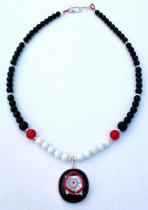 Necklace with sterling silver, onyx, coral, and fused-glass pendant