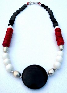 Necklace with hand-made sterling silver beads, onyx, coral, and onyx pendant