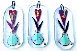Fused-glass decorations with vase with a single heart flower