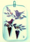 Fused-glass Valentine's Day decoration of two perched birds and two hearts hanging from twigs