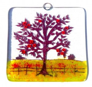 Glass decoration of red apple tree in farmer's field