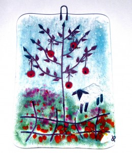 Glass decoration of red apple tree in flowery field with sheep